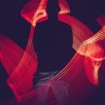 A silhouette of a person surrounded by artistic red light trails, creating a dynamic visual effect.